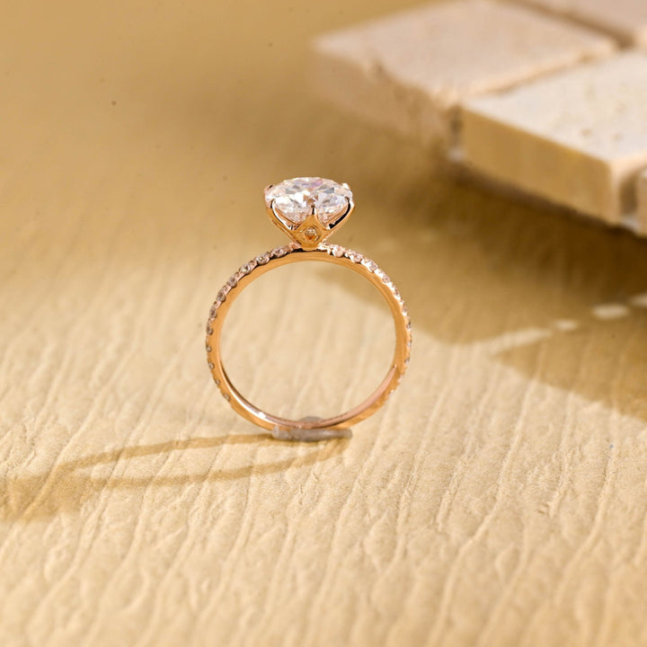 Round pave engagement ring close-up highlighting diamond sparkle