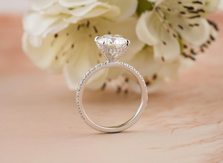 IGI certified round cut diamond in hidden halo engagement ring setting