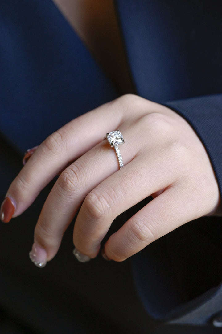 Side angle of round hidden halo diamond engagement ring