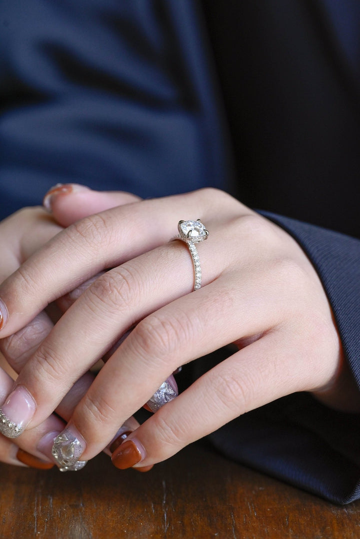 Profile view of round cut hidden halo engagement ring band