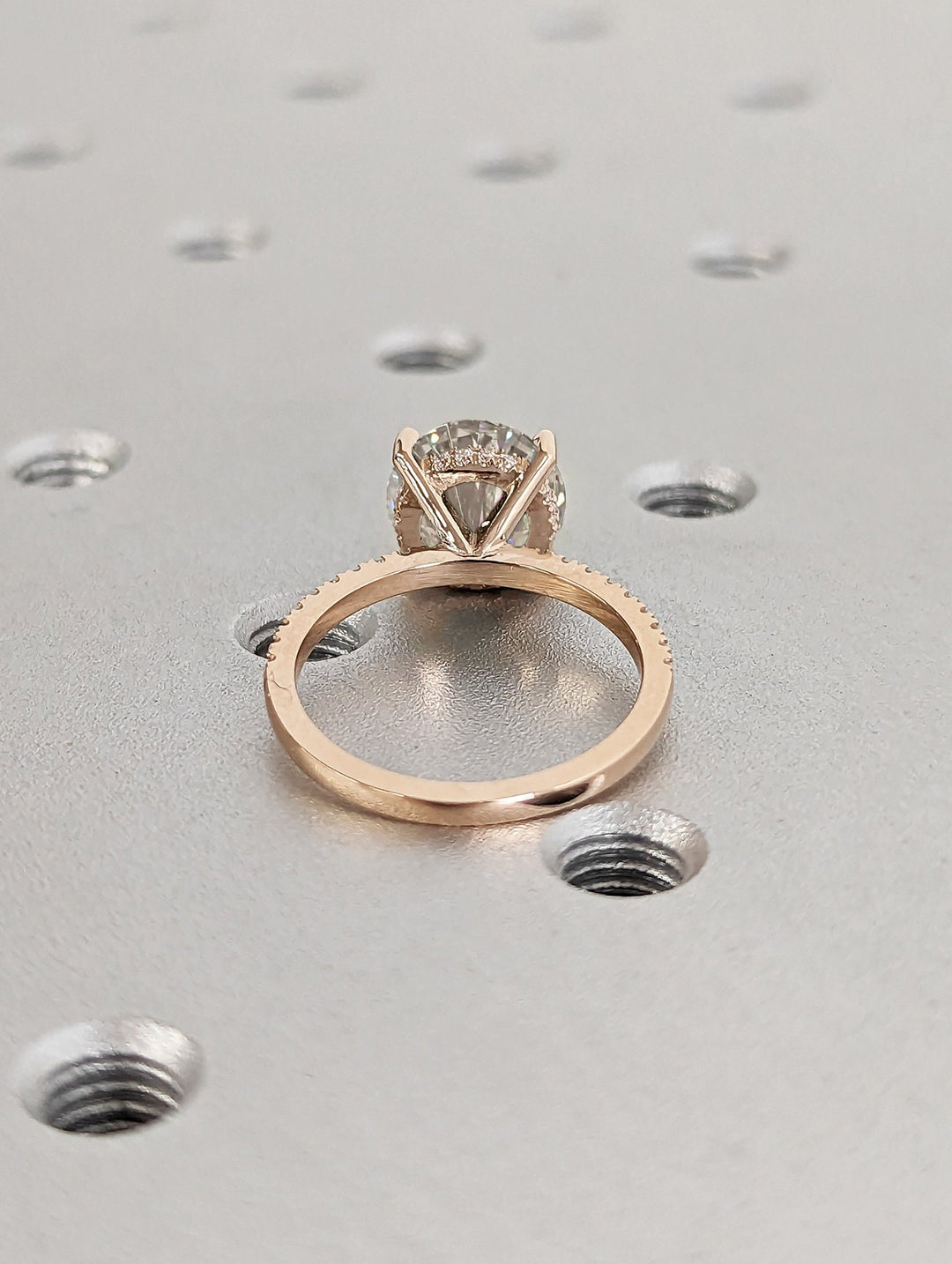 Round hidden halo lab grown diamond ring side profile in gold setting
