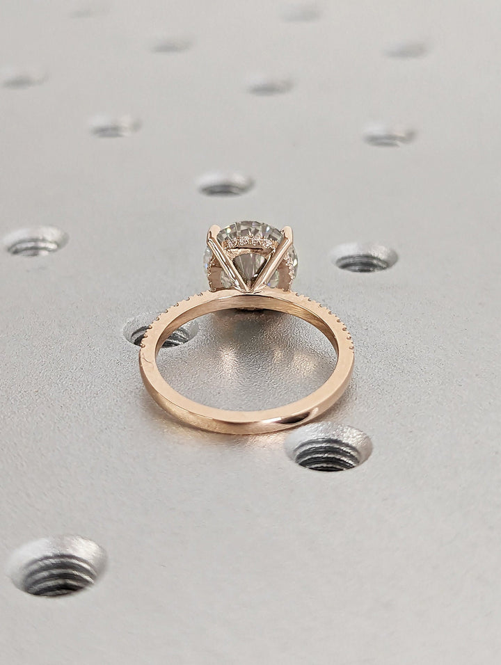 Round hidden halo lab grown diamond ring side profile in gold setting
