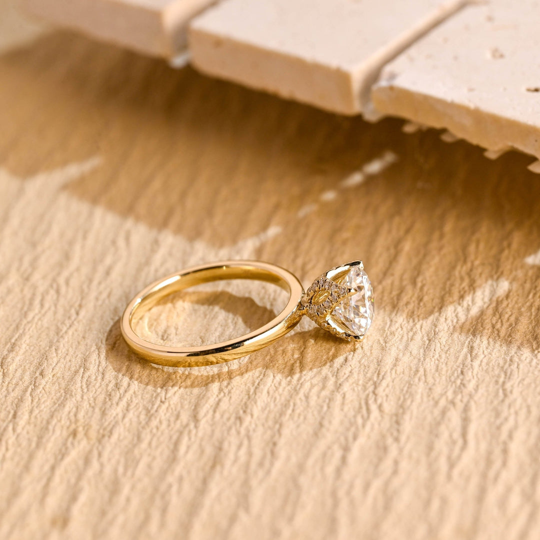Round hidden halo diamond ring presented in signature gift packaging