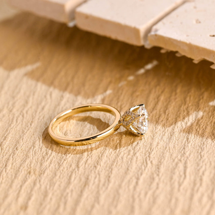 Round hidden halo diamond ring presented in signature gift packaging