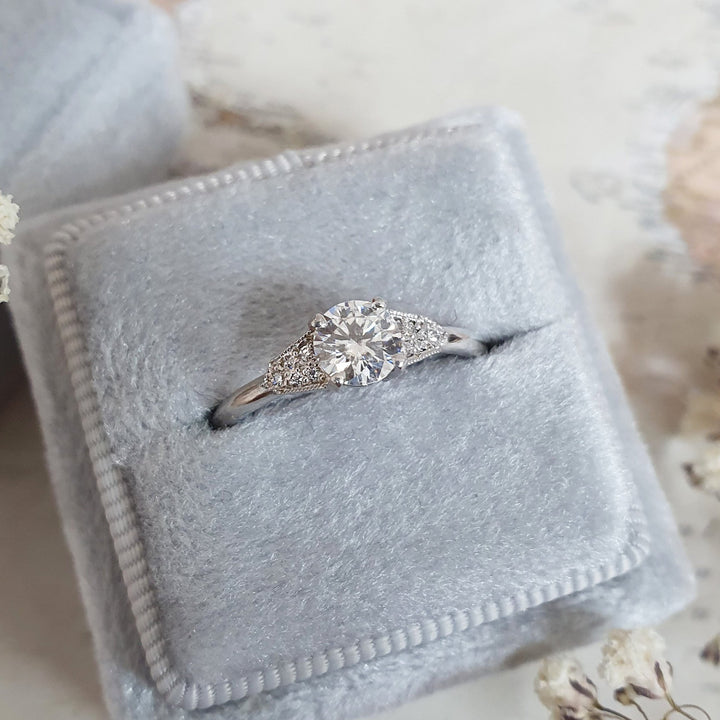 Round milgrain lab grown diamond ring in jewelry gift box