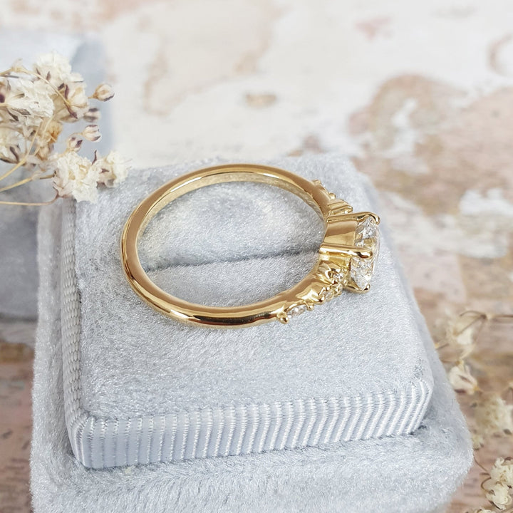 Round cluster engagement ring with IGI certificate and packaging
