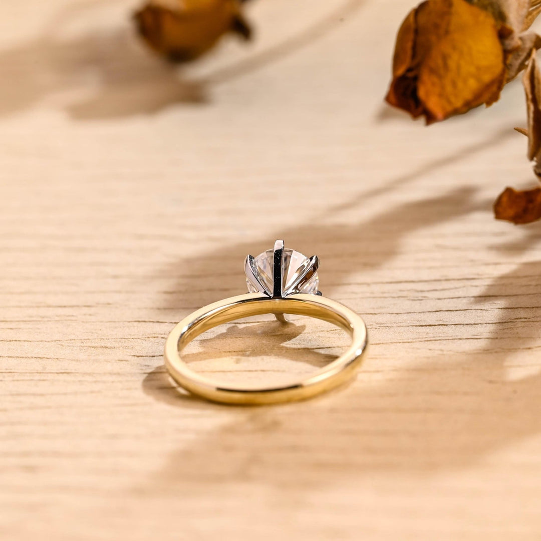 Round solitaire engagement ring offered in gold and platinum