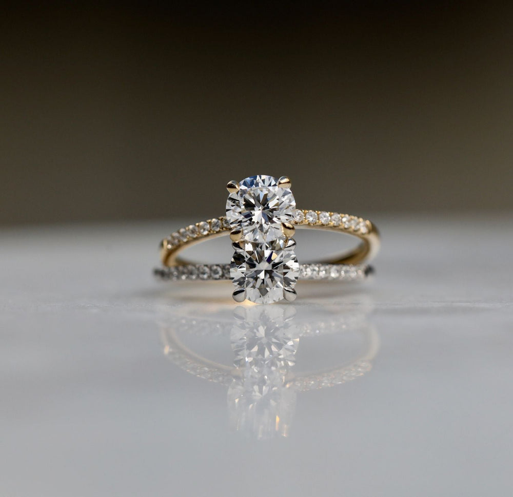 Round solitaire engagement ring close-up showing E/VS1 diamond clarity