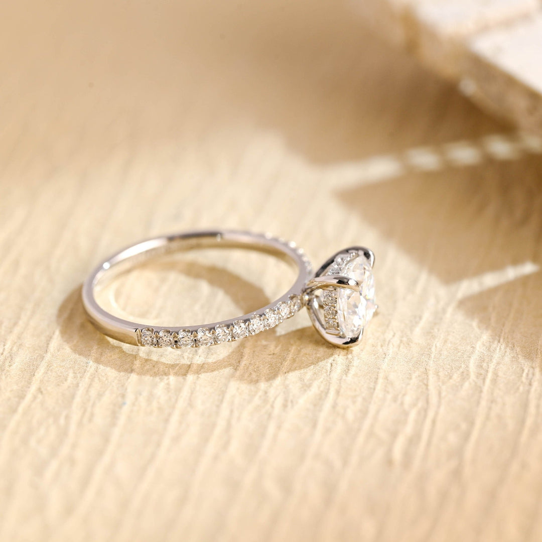 Round hidden halo engagement ring close-up highlighting diamond sparkle