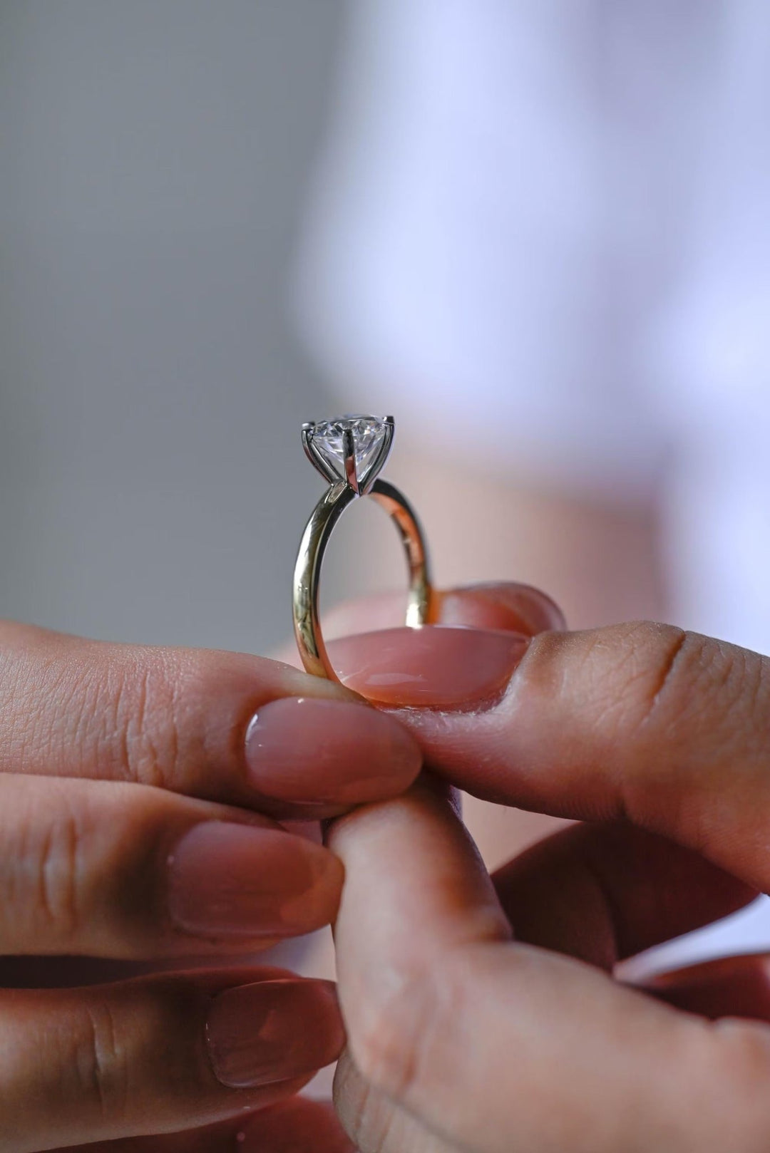 Round solitaire engagement ring with IGI certificate and packaging