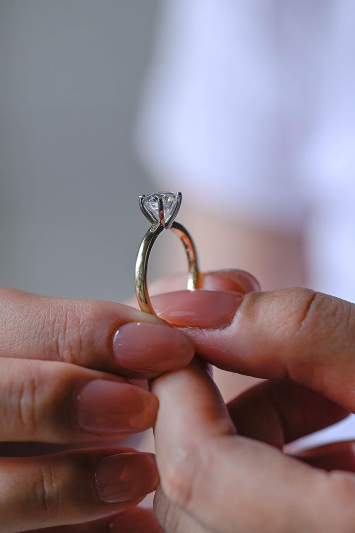 Round solitaire engagement ring with IGI certificate and packaging