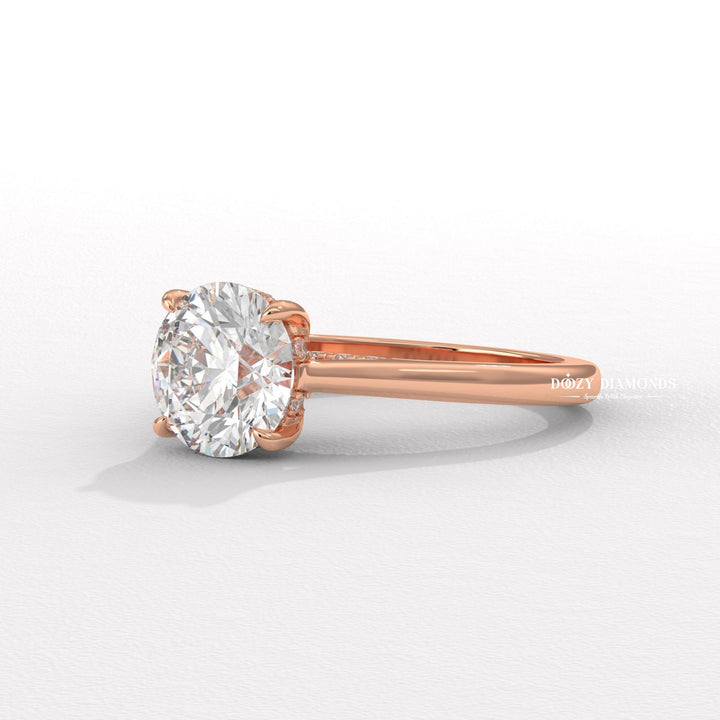 Round cut diamond ring worn on hand