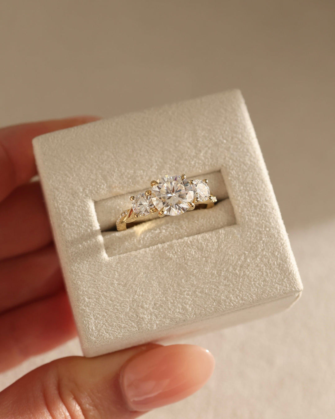 elegant three stone setting, bridal three stone setting, engagement three stone setting, symmetrical three stone setting, asymmetrical three stone setting, graduated three stone setting