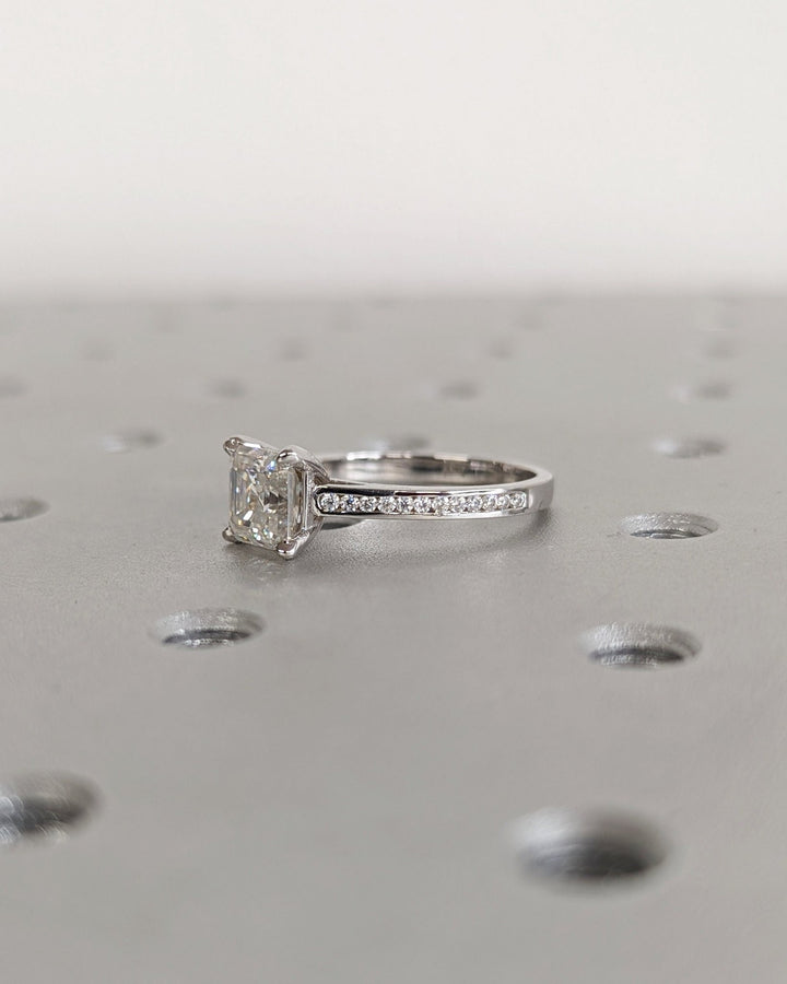 Profile view of asscher cut solitaire engagement ring band