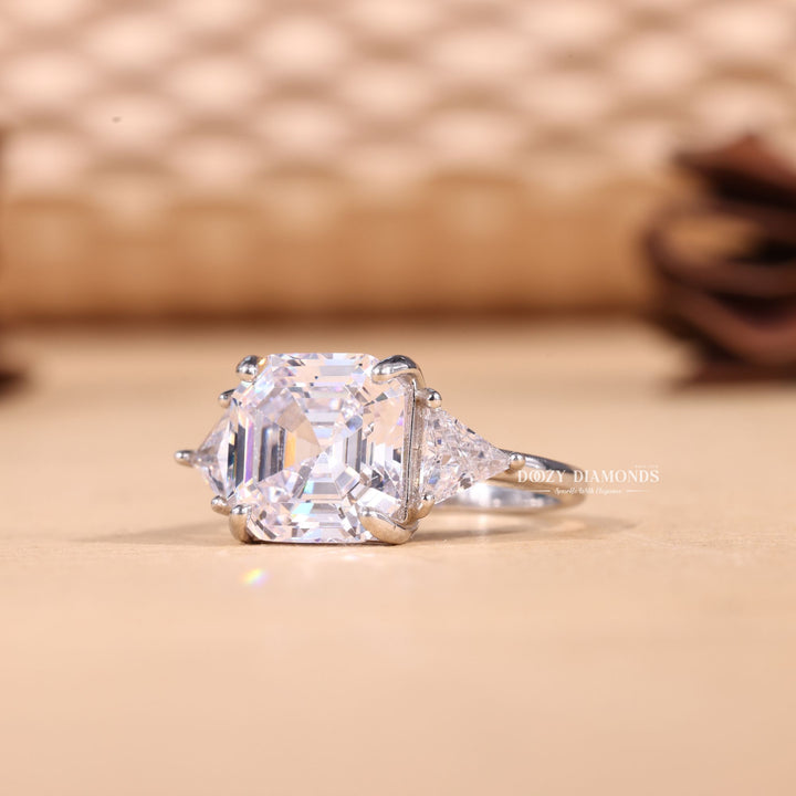 Asscher cut engagement ring shown with authenticity certificate