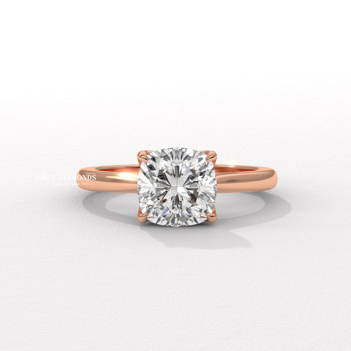 Cushion solitaire engagement ring close-up highlighting diamond sparkle
