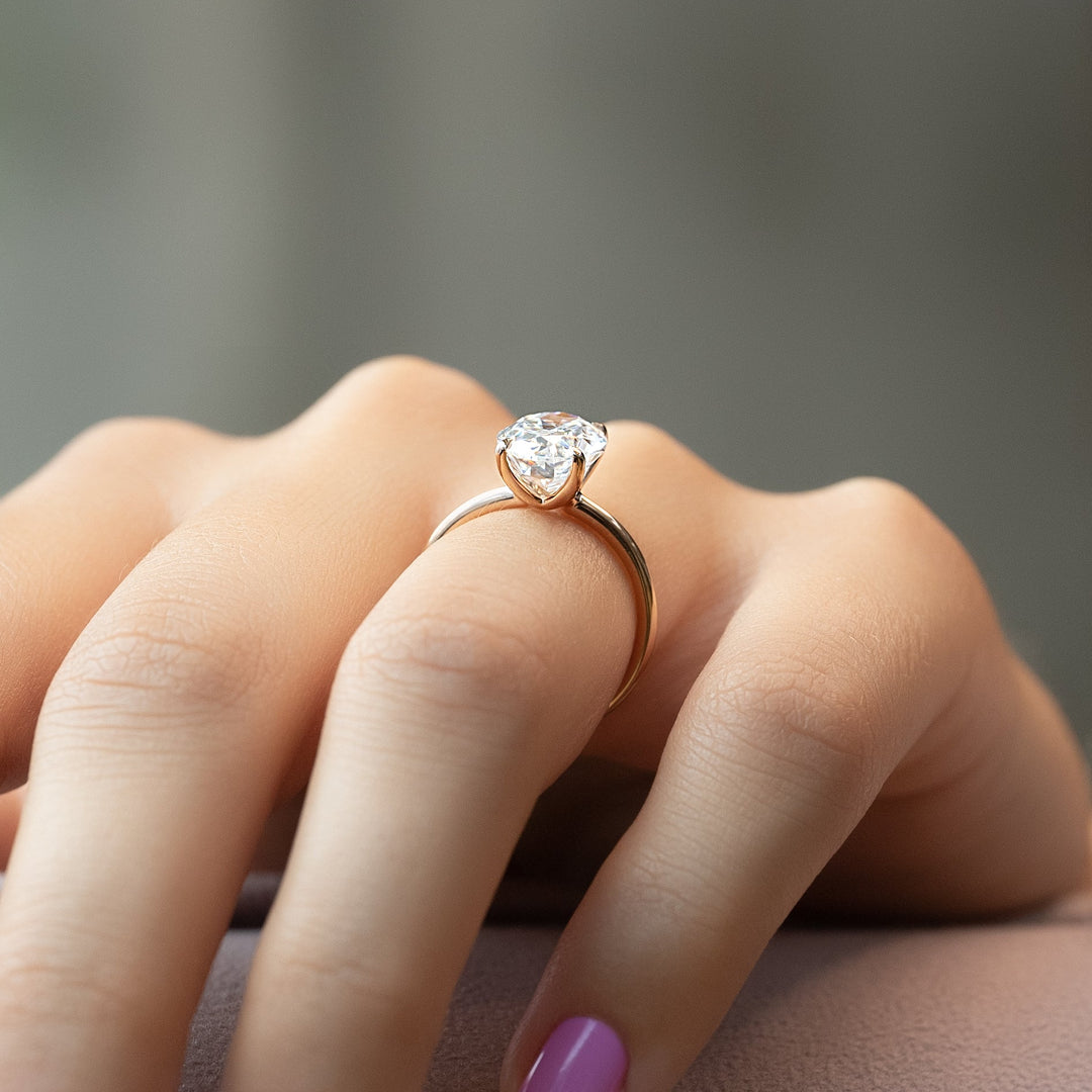 Oval solitaire engagement ring offered in gold and platinum