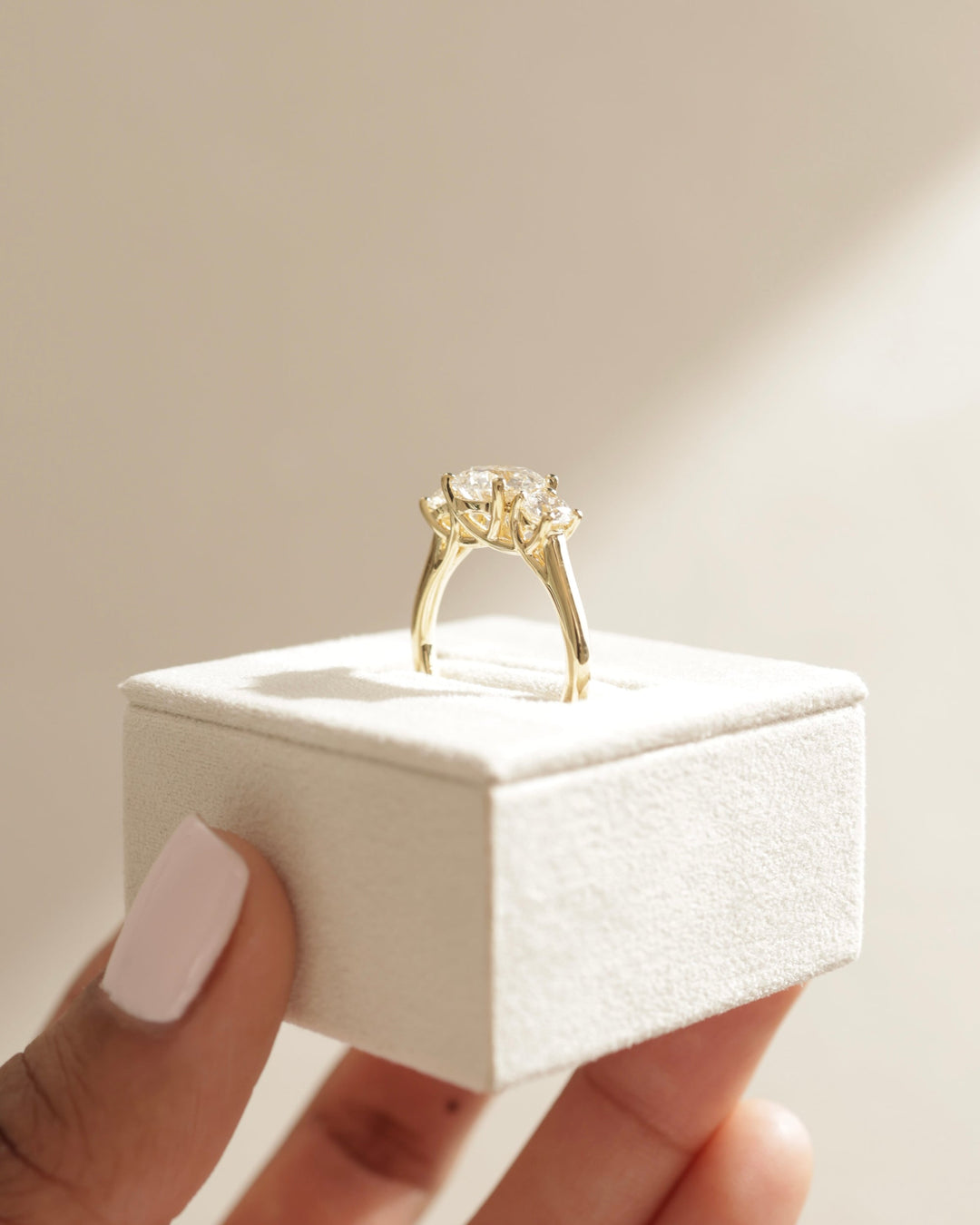 modern prong three stone setting, vintage three stone setting, classic prong trio setting, tapered three stone setting, geometric three stone setting, architectural three stone setting, clean line three stone setting, polished metal setting, smooth metal setting, fine metal setting,