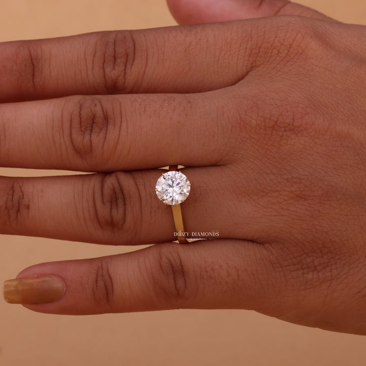 Certified round cut diamond featured in solitaire engagement ring