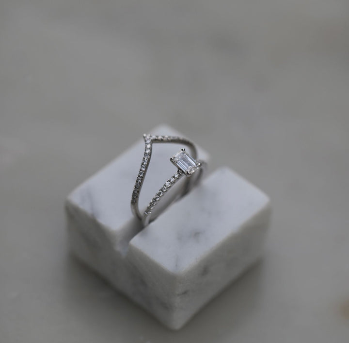 Emerald solitaire engagement ring with certified lab grown diamond