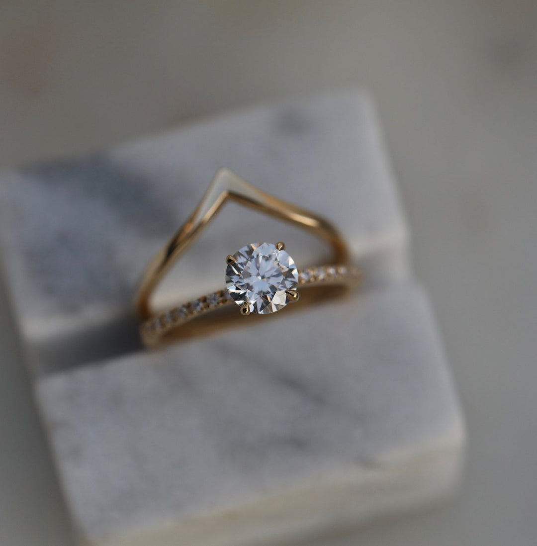 Close-up of round cut center diamond in solitaire engagement ring