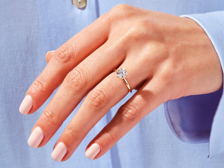 Fine craftsmanship detail on round solitaire engagement ring