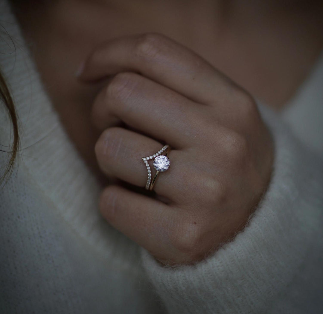 Fine craftsmanship detail on round solitaire engagement ring