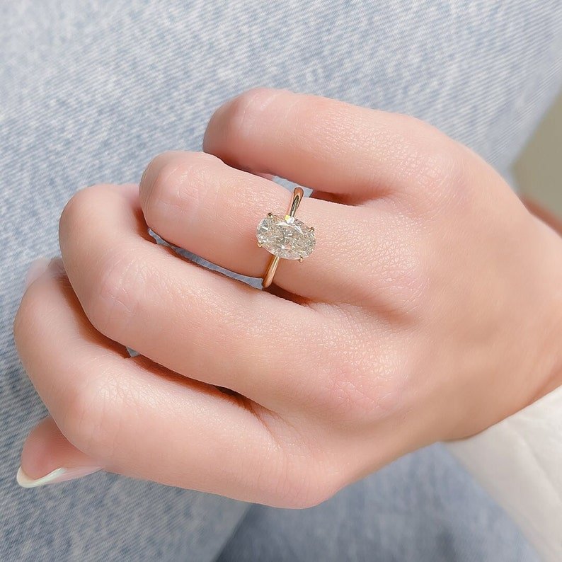 IGI certified oval cut diamond in solitaire engagement ring setting