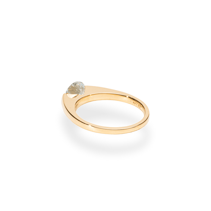Lifestyle shot of round solitaire diamond ring on hand