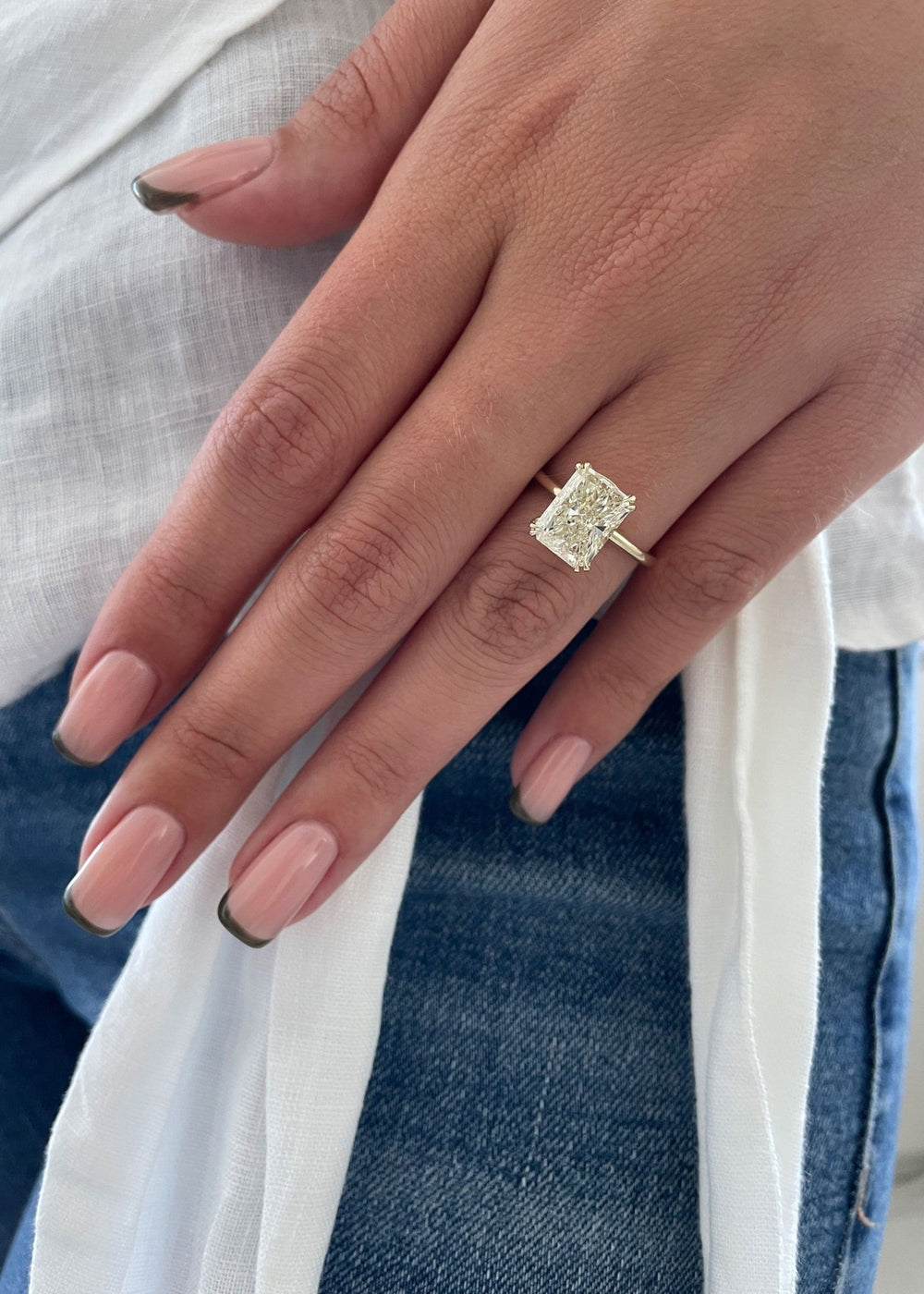 Radiant solitaire engagement ring close-up showing high clarity diamond clarity