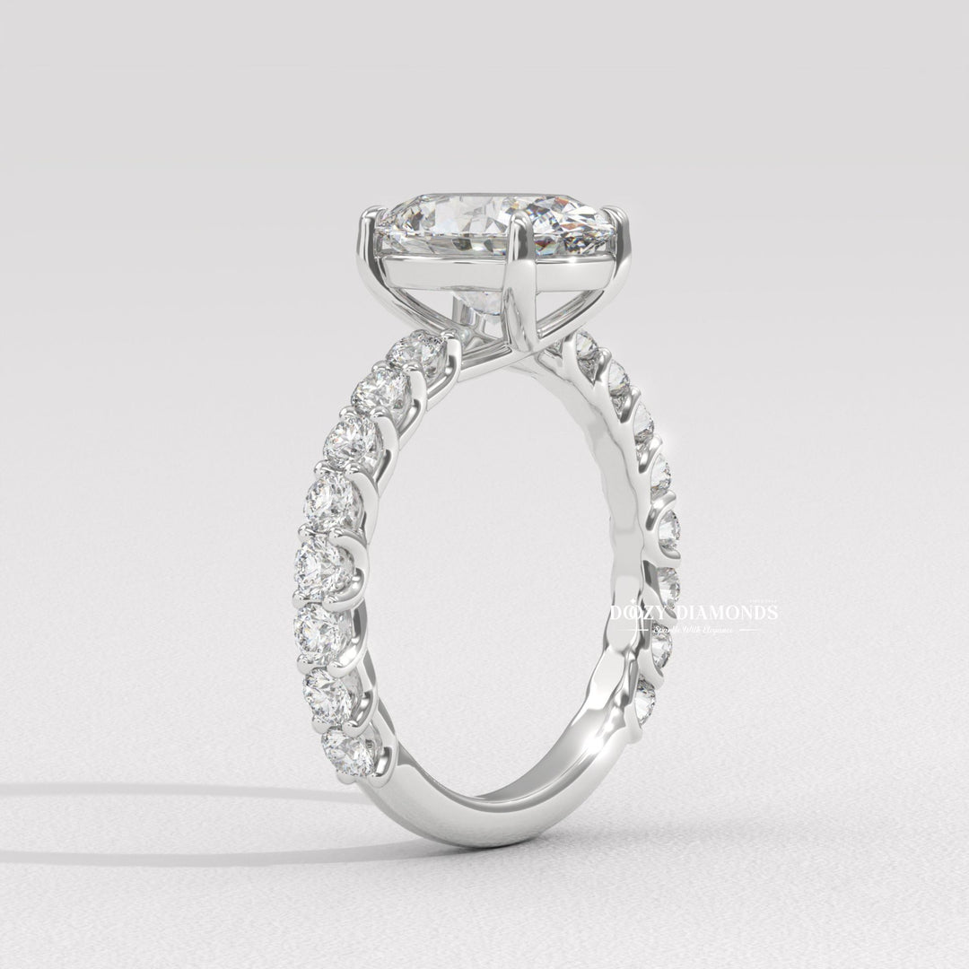 Macro shot of oval cut diamond facets in pave ring setting