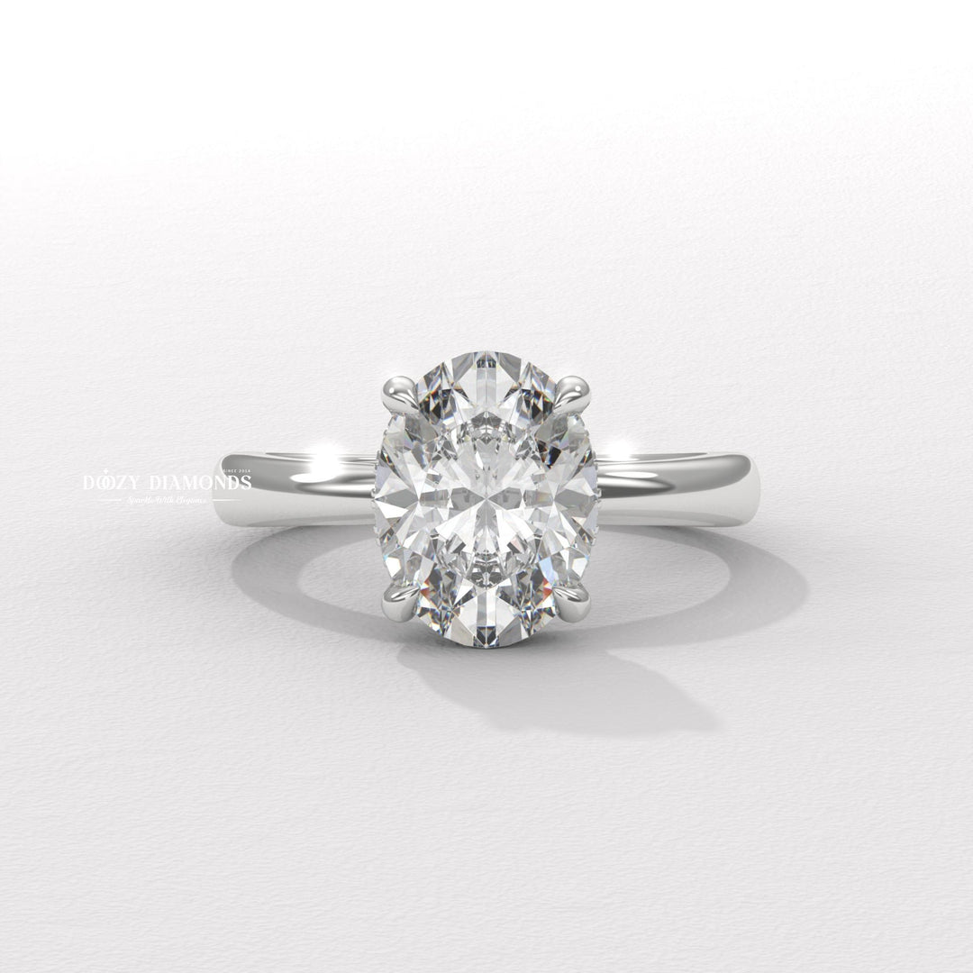 Oval cut solitaire engagement ring shown in real-life wear