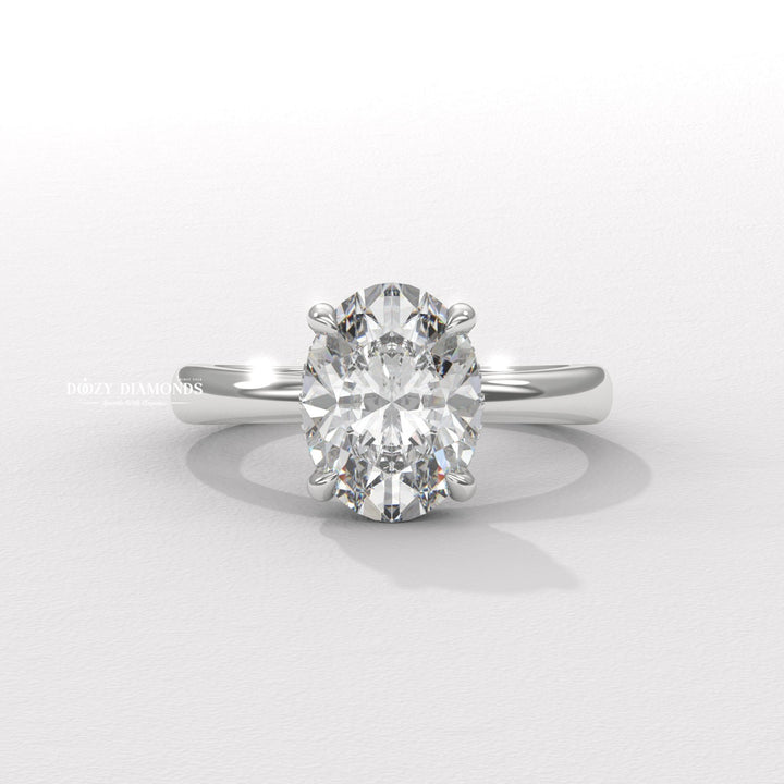 Oval cut solitaire engagement ring shown in real-life wear