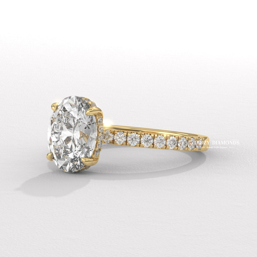 Detailed close-up of oval hidden halo diamond engagement ring