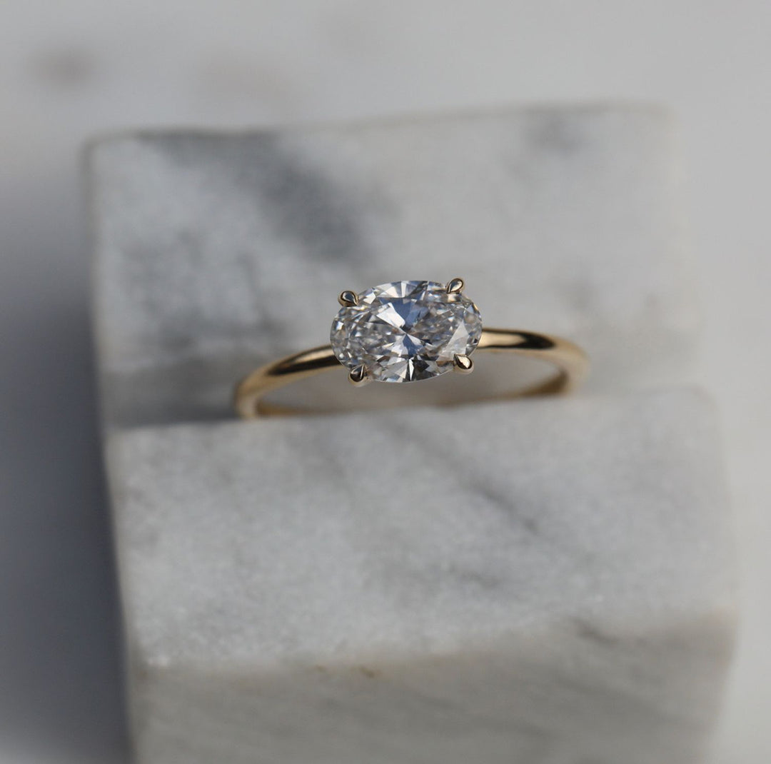 Close-up of oval cut center diamond in solitaire engagement ring