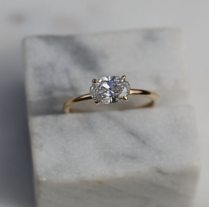 Close-up of oval cut center diamond in solitaire engagement ring