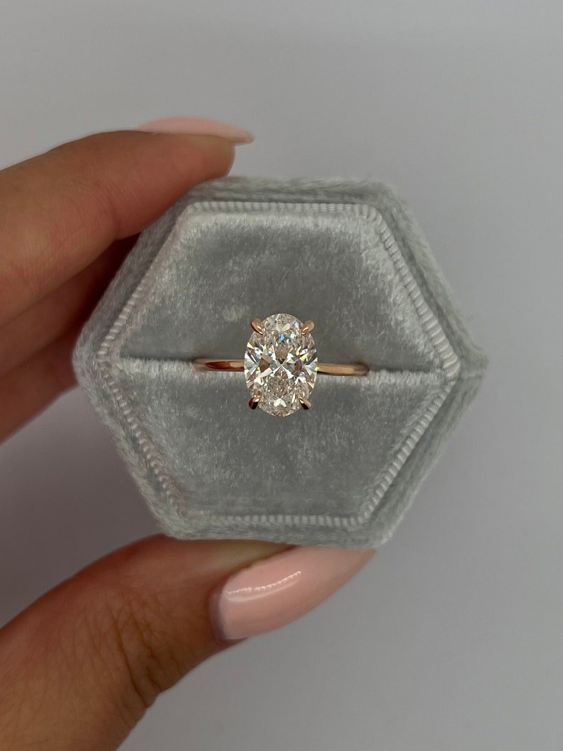 Shop oval hidden halo lab grown diamond engagement ring