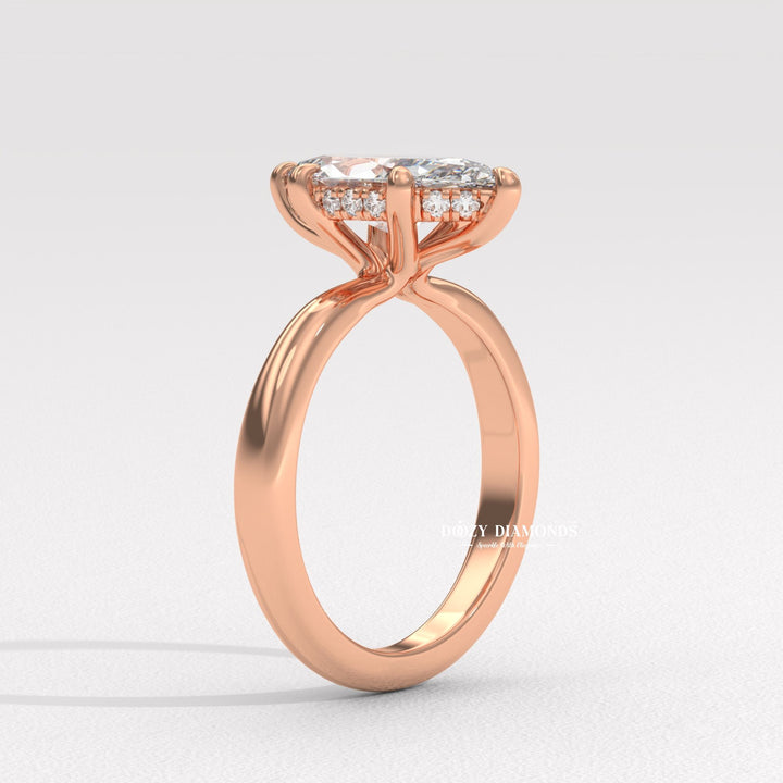 Marquise hidden halo diamond ring displayed on jewelry stand
