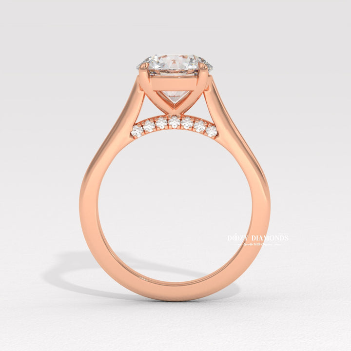 Round solitaire engagement ring viewed from the side