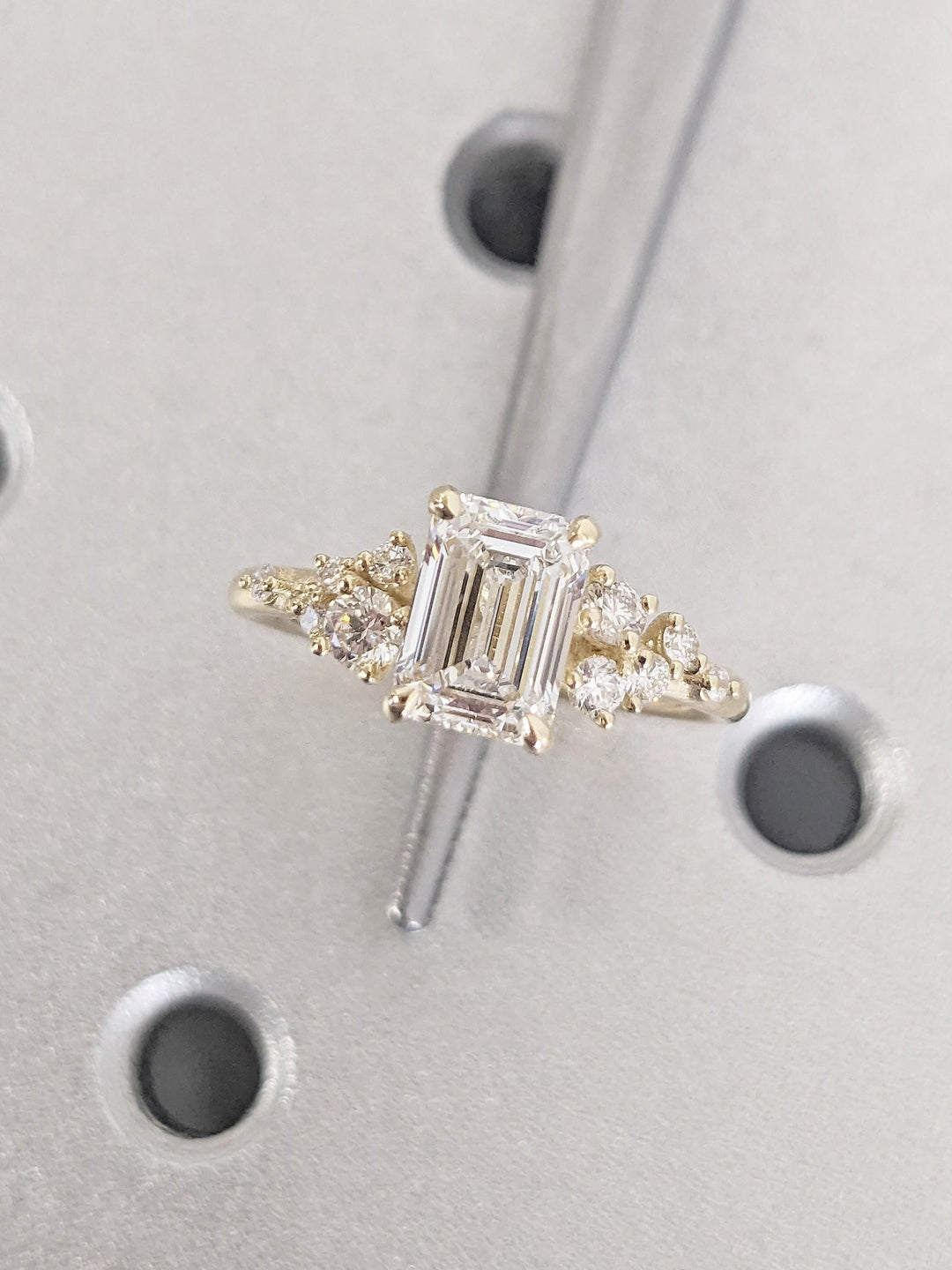Emerald cluster engagement ring close-up showing high clarity diamond clarity