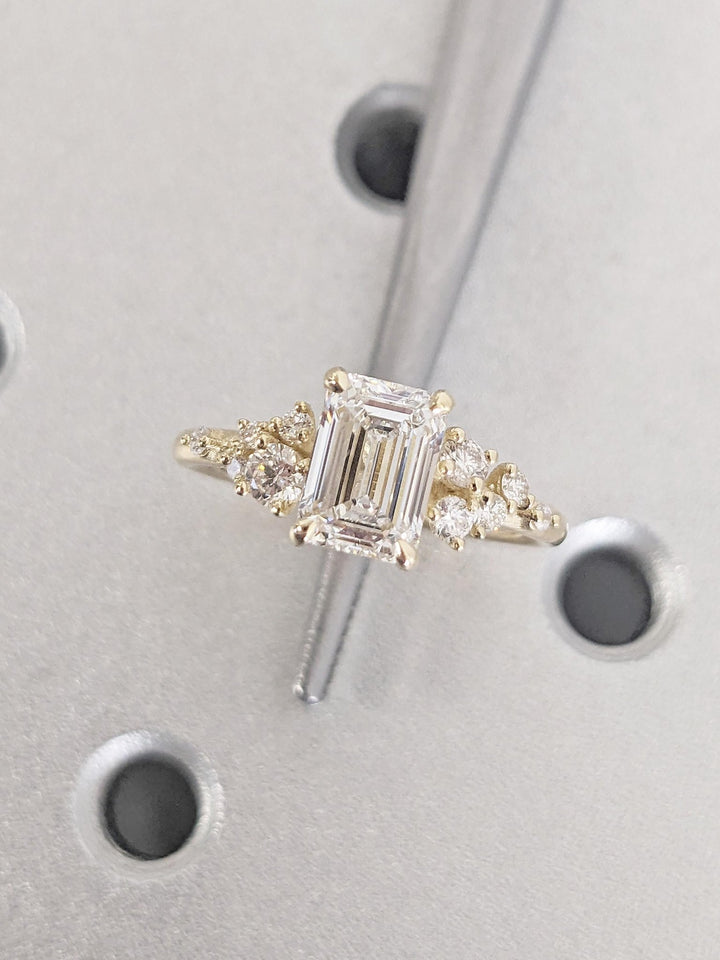 Emerald cluster engagement ring close-up showing high clarity diamond clarity