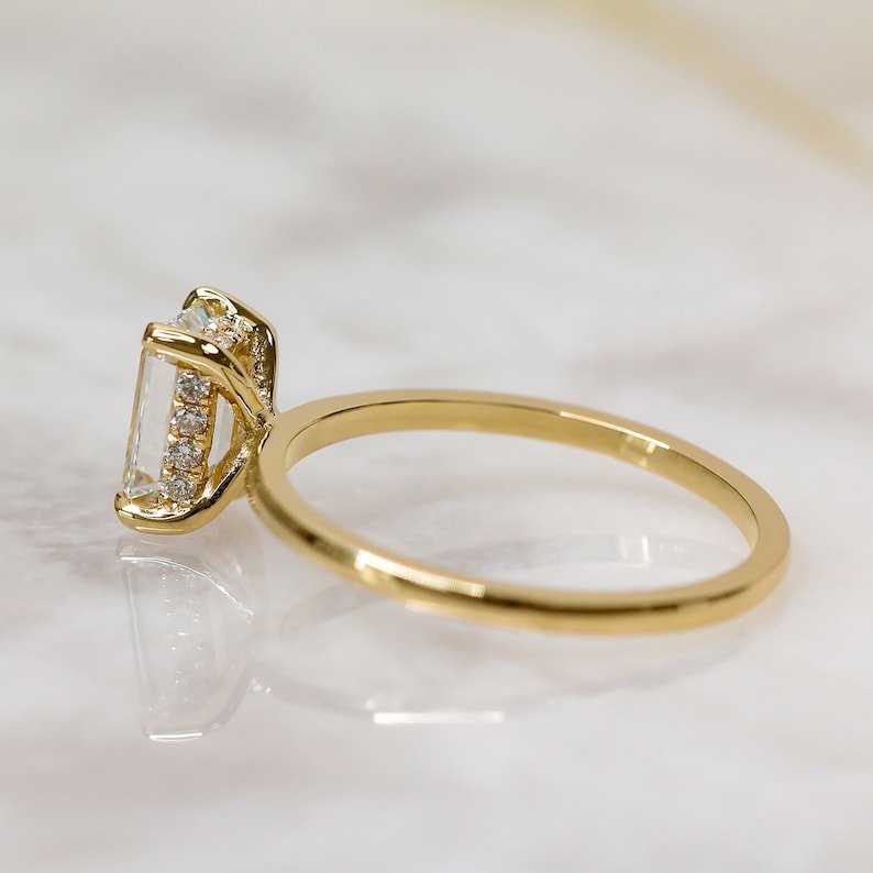 Emerald cut engagement ring side view showing band detail