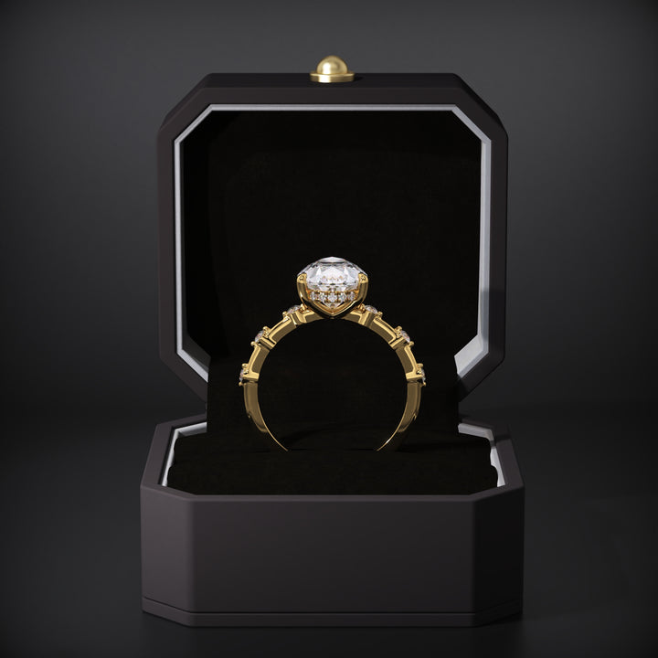 Detailed close-up of pear hidden halo diamond engagement ring