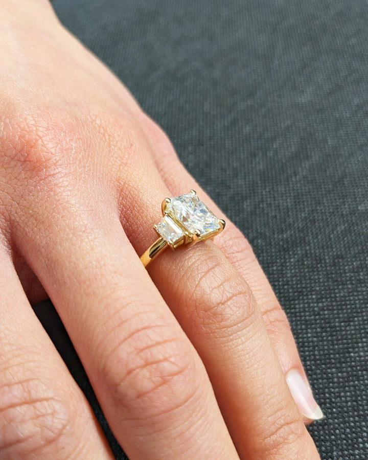 Radiant solitaire engagement ring viewed from the side