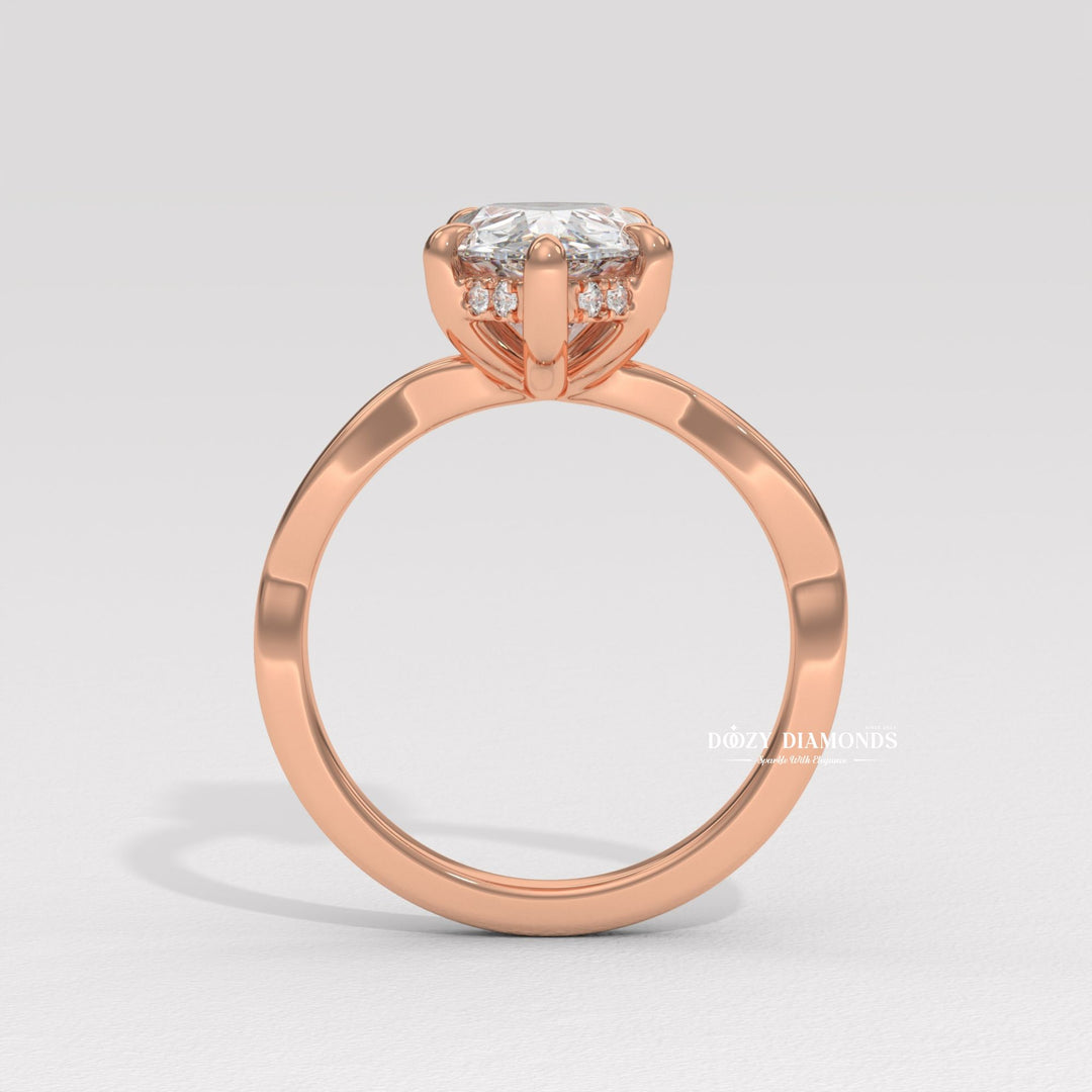 Pear solitaire engagement ring viewed from the side