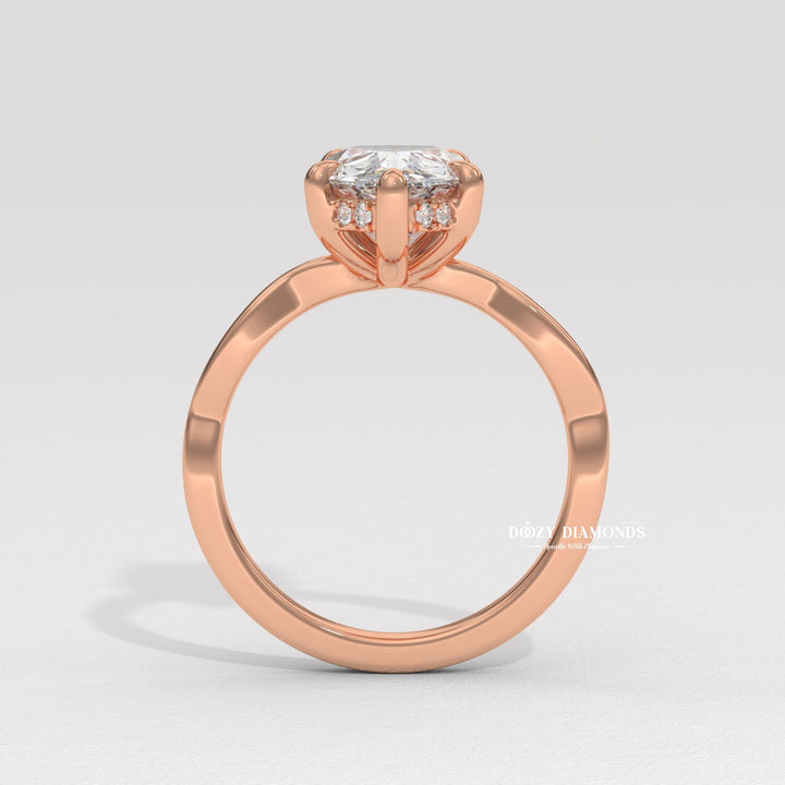 Pear solitaire engagement ring viewed from the side