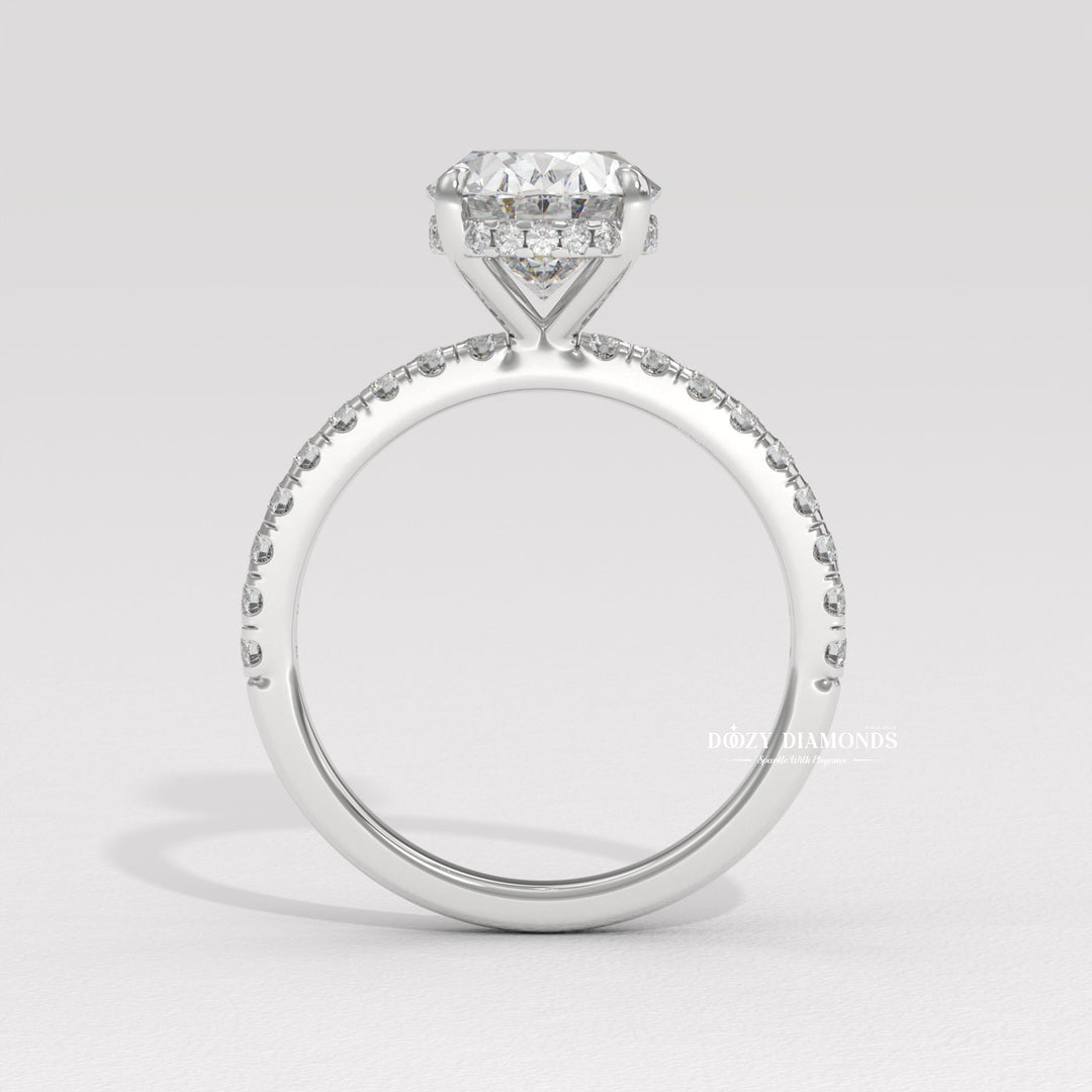 Side angle of oval hidden halo diamond engagement ring