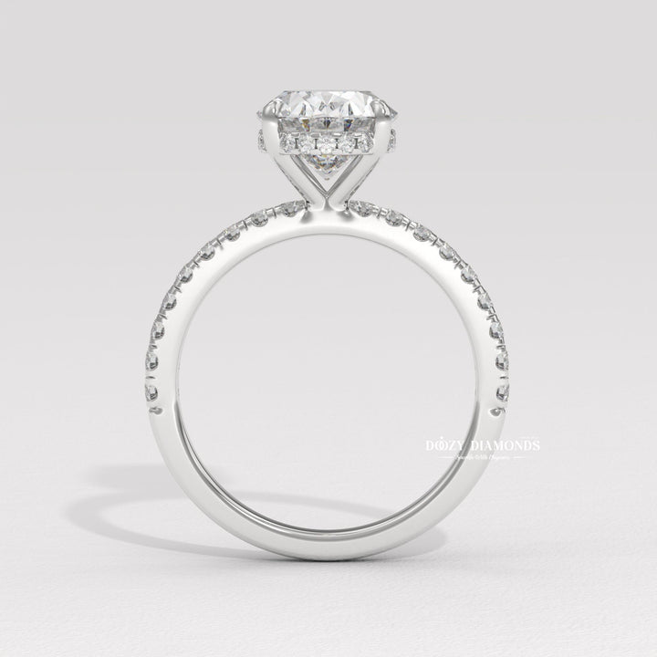 Side angle of oval hidden halo diamond engagement ring