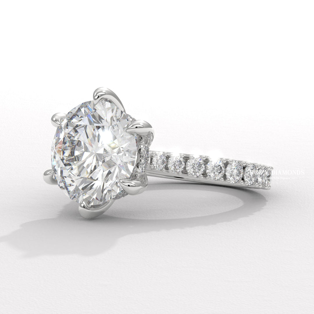 Round hidden halo engagement ring finished in polished solid gold