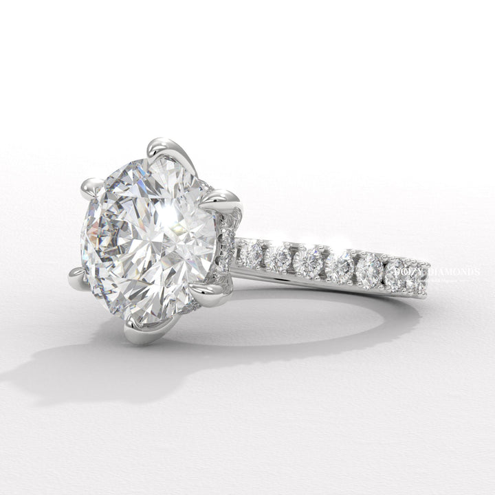 Round hidden halo engagement ring finished in polished solid gold